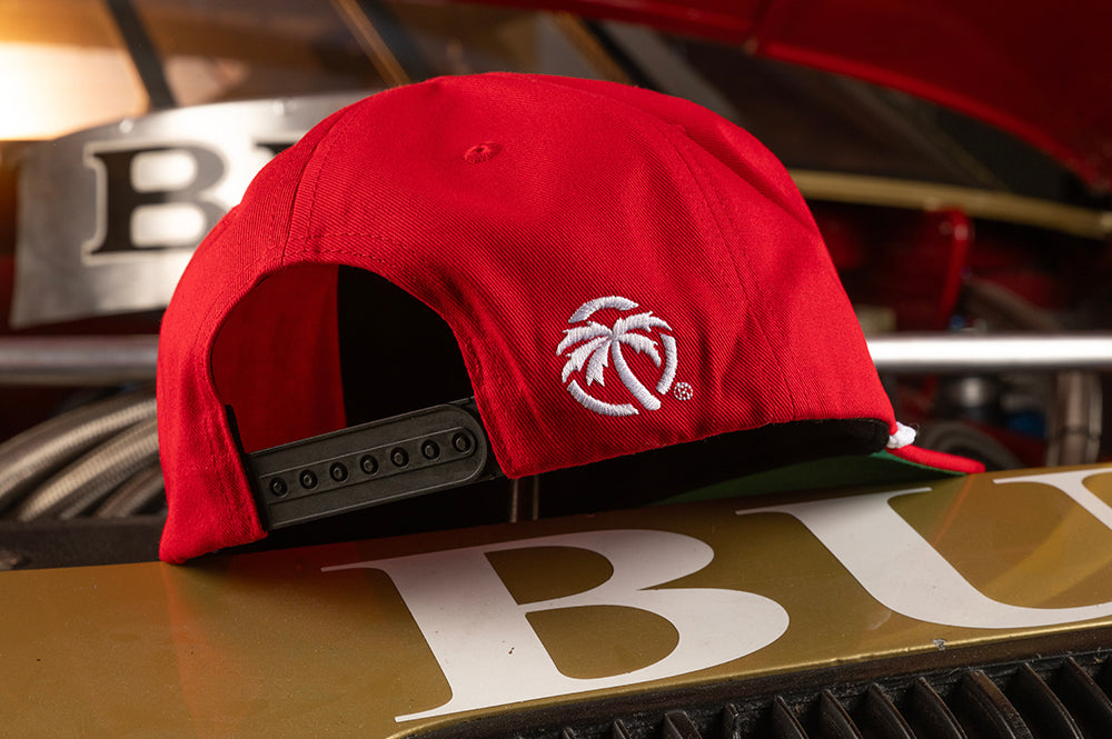 Sitting on top of the nascar is the Heat Wave Visual Trading Paint Red Hat.